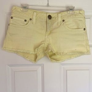 Free People Low-Rise Cutoff Shorts in Lime Green
